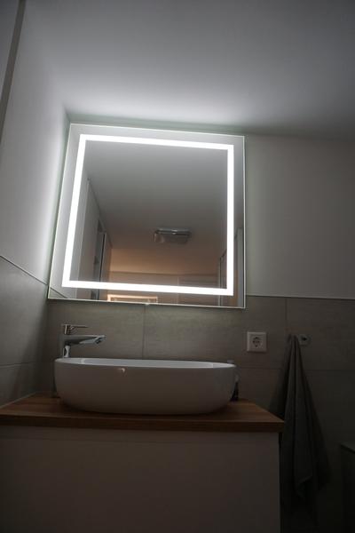 Washbasin with illuminated mirror