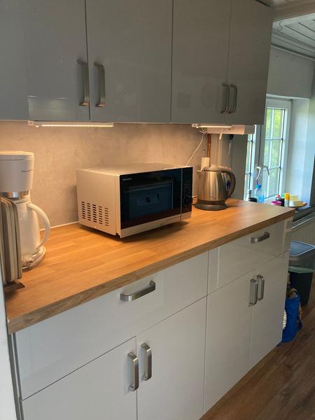 Kitchen with microwave and coffee machine