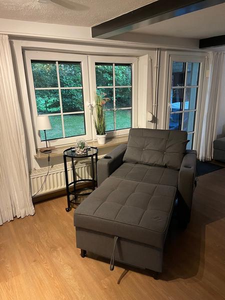 Chair bed by the window