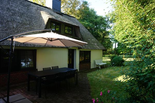 Terrace with seating and parasol